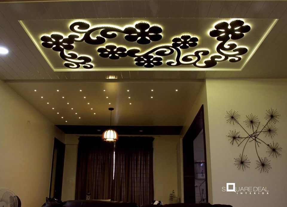 Floral MDF Decorative False Ceiling Highlighted with Cove Lights in centre with Wood Panels